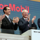 Exxon management clapping at the New York Stock Exchange.